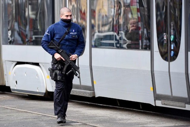 Belgian police shoot suspect in Europe-wide terror raids