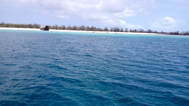 Vessel grounded off Seychelles' Aldabra Island awaits high tide to move