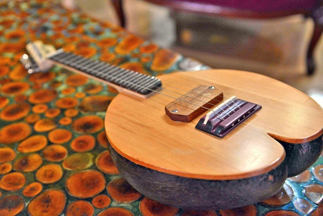 Six-string guitar made Seychelles style: carved by a coco de mer