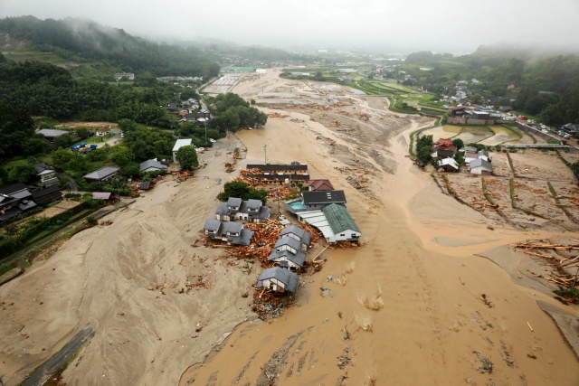 Huge floods sweep southern Japan, at least 15 missing
