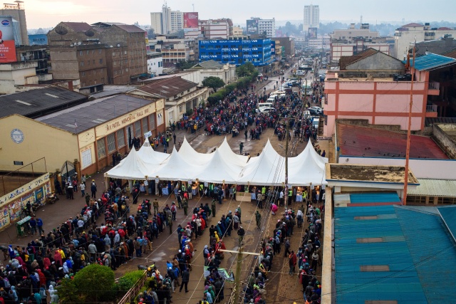 Kenyans vote in tight, tense elections