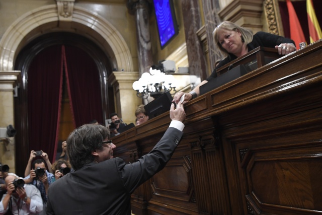Spain readies to impose direct rule as Catalonia fights back
