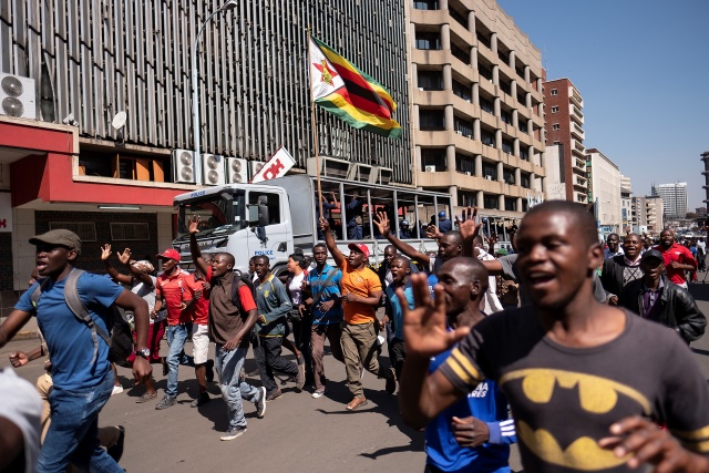 Opposition protests as ZANU-PF wins Zimbabwe parliament