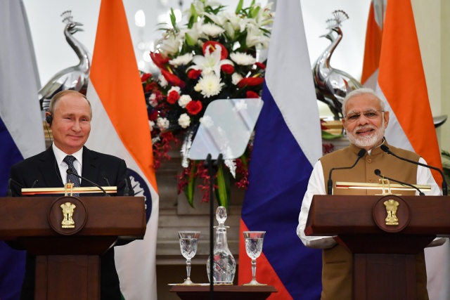 Hugs as Putin clinches India defence deal