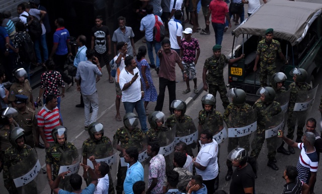 Pressure mounts on Sri Lankan president as crisis turns violent