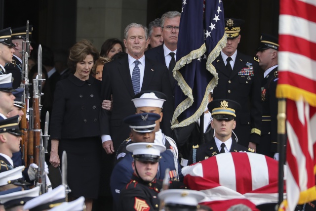 Washington sets aside divisions as US bids farewell to Bush