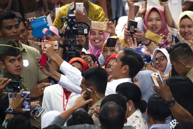 Indonesian leader points to reelection victory as rival rejects results