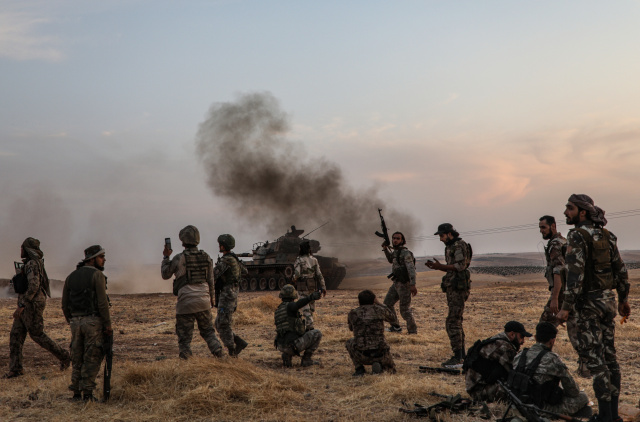 Syria Kurds defend key town as Turkey ignores US