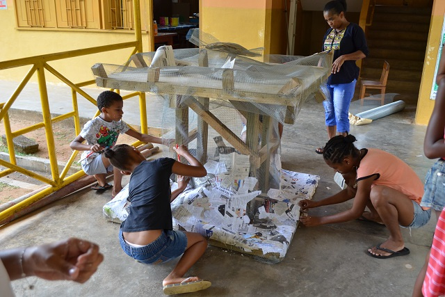 Children in Seychelles creating artwork to raise awareness on reef protection