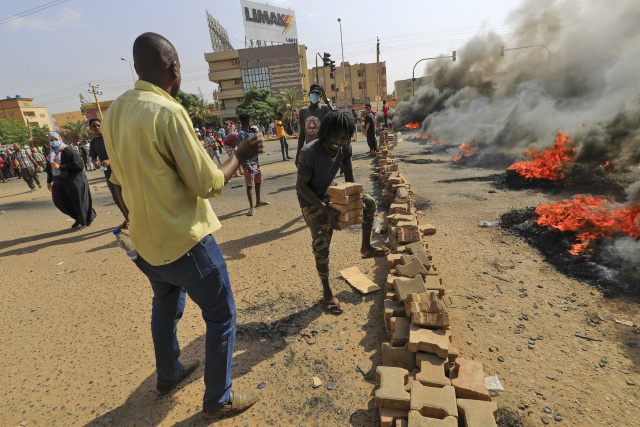 Security tightens grip in coup-hit Sudan as global pressure bites
