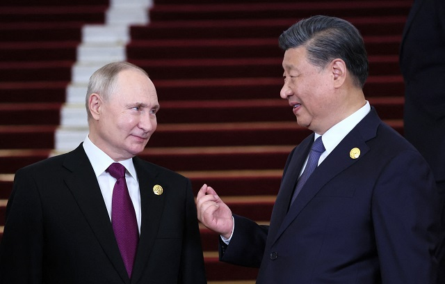 Xi welcomes 'dear friend' Putin to Beijing