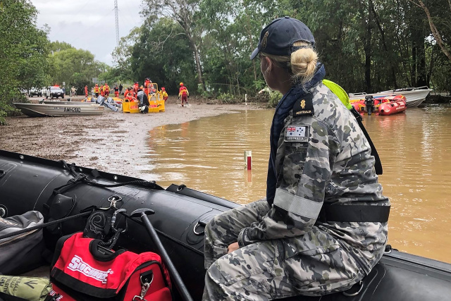 Rescue teams evacuate flood-ravaged Australian town