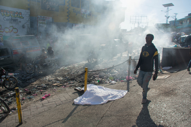 Bodies found in Haitian suburb as gang violence rages for third week