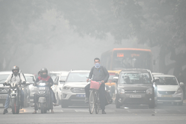 India's capital shuts schools as 'death trap' smog chokes city